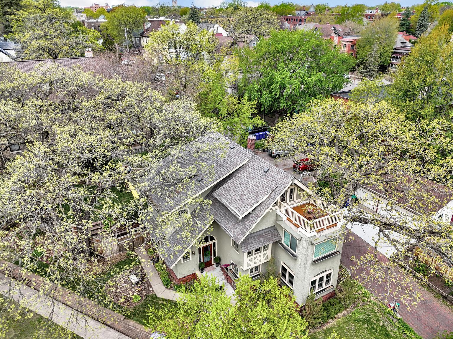 View from above highlighting the impressive new roof and stunning rooftop patio. This sun-drenched sanctuary offers incredible city views and a peaceful, private escape, all within a meticulously maintained historic estate.