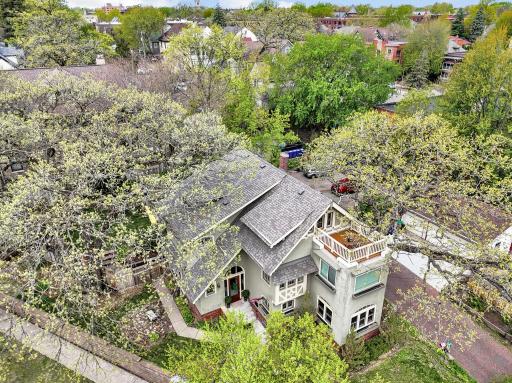 View from above highlighting the impressive new roof and stunning rooftop patio. This sun-drenched sanctuary offers incredible city views and a peaceful, private escape, all within a meticulously maintained historic estate.
