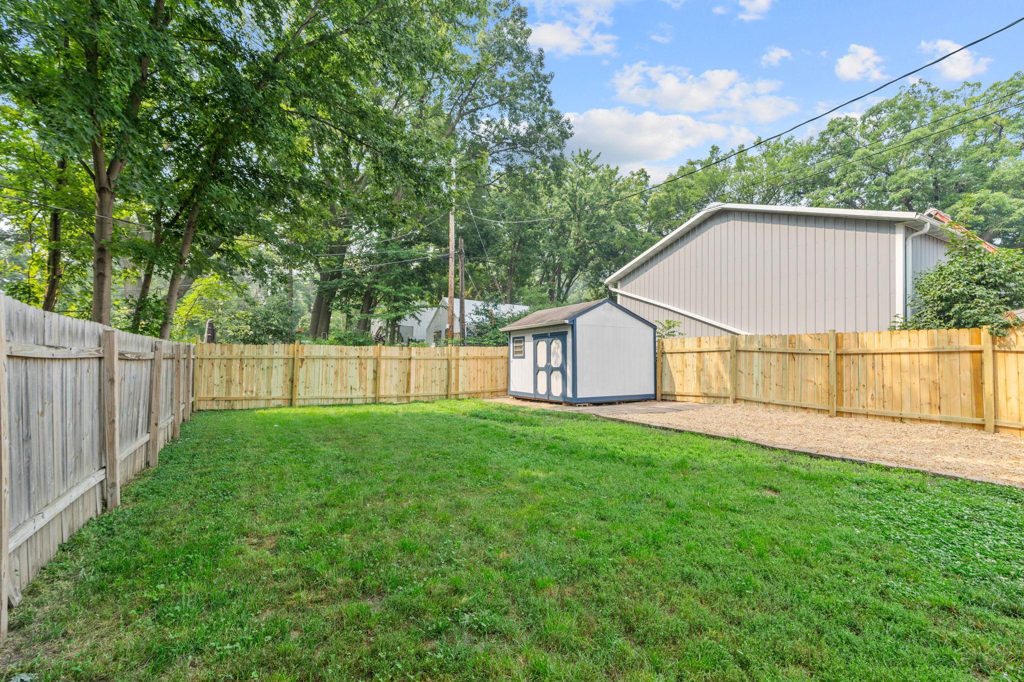 Massive rear yard with a large shed and even MORE porch space!