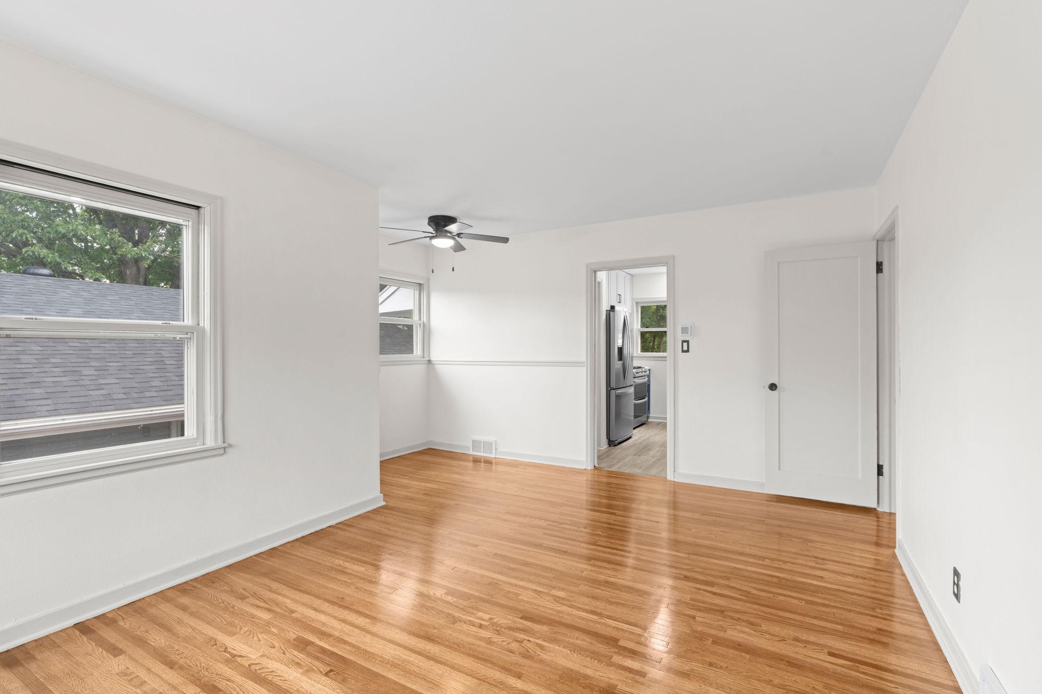 This living/dining room is large and airy with great natural light.