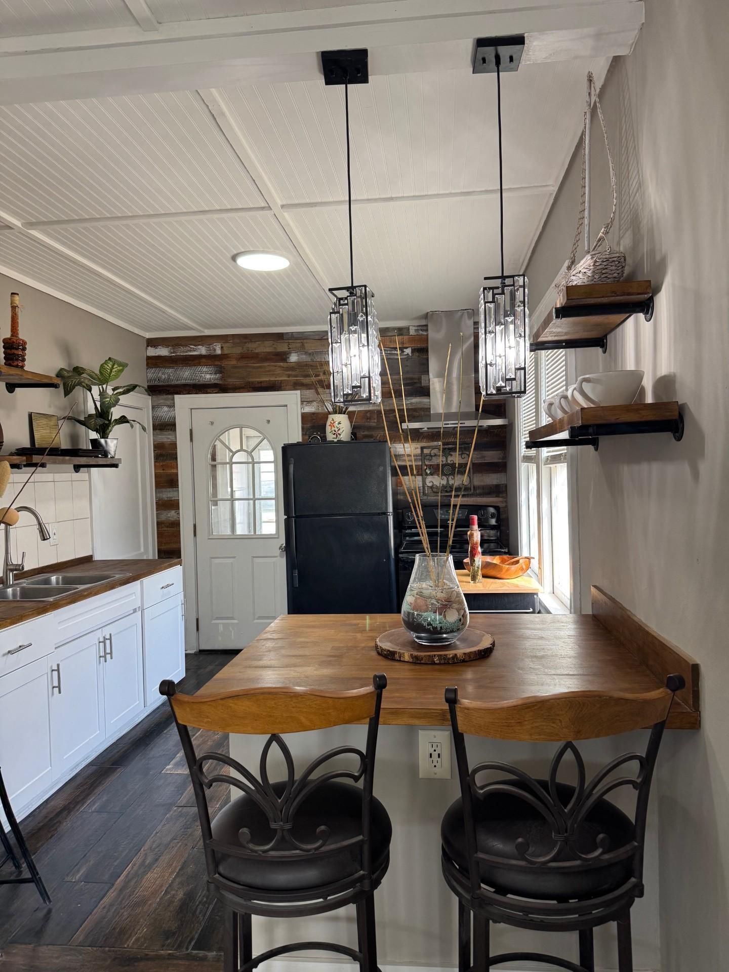 Dining peninsula, new ceiling and lighting, custom shelving