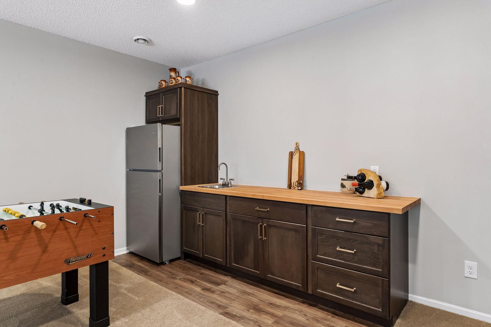 There is even a new walk-up wet bar with custom cabinetry with a butcher block countertop - great for keeping your snacks and beverages handy!