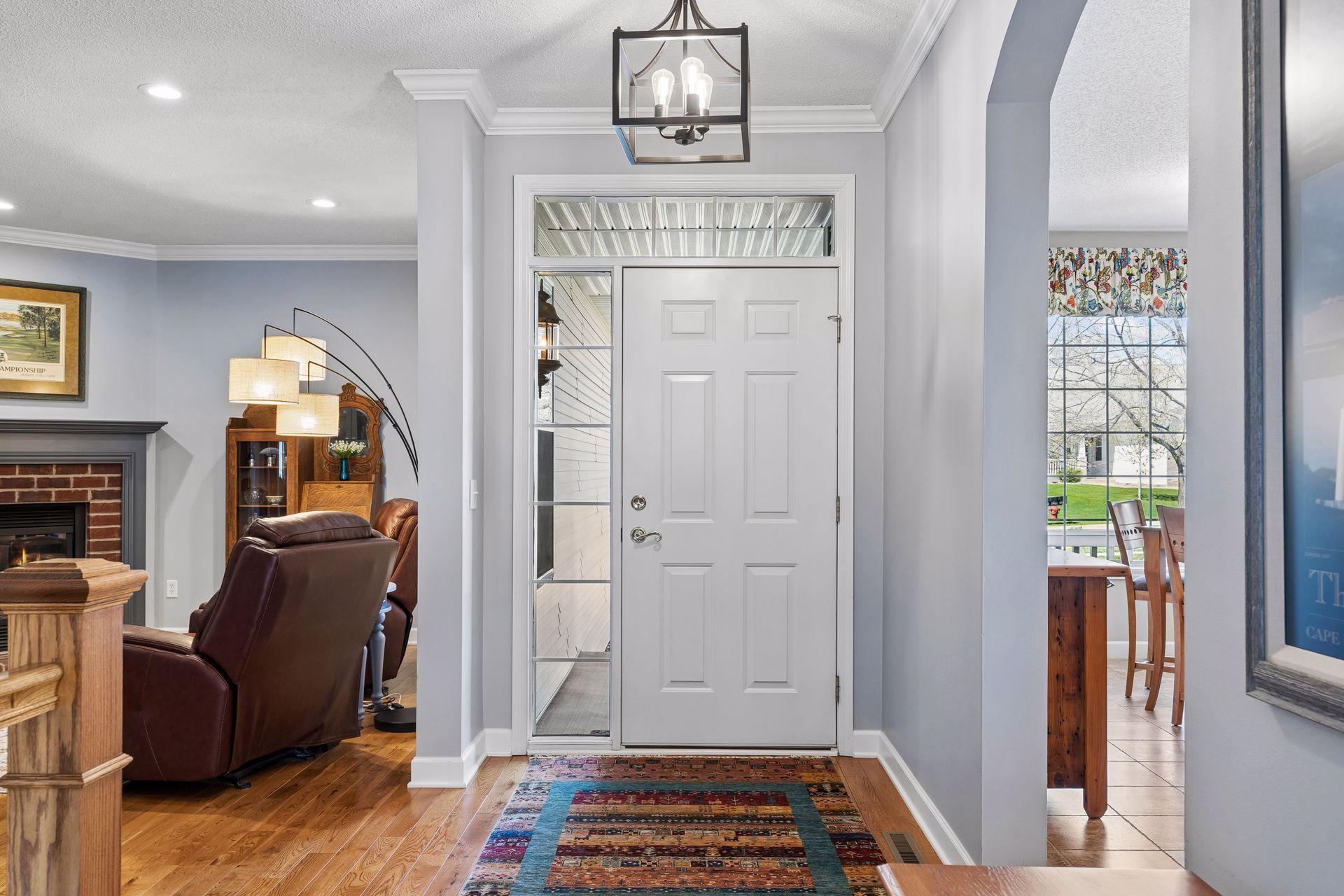 Step inside to discover a home that has been thoughtfully updated with designer lighting, enameled crown molding and beautiful hardwood flooring.