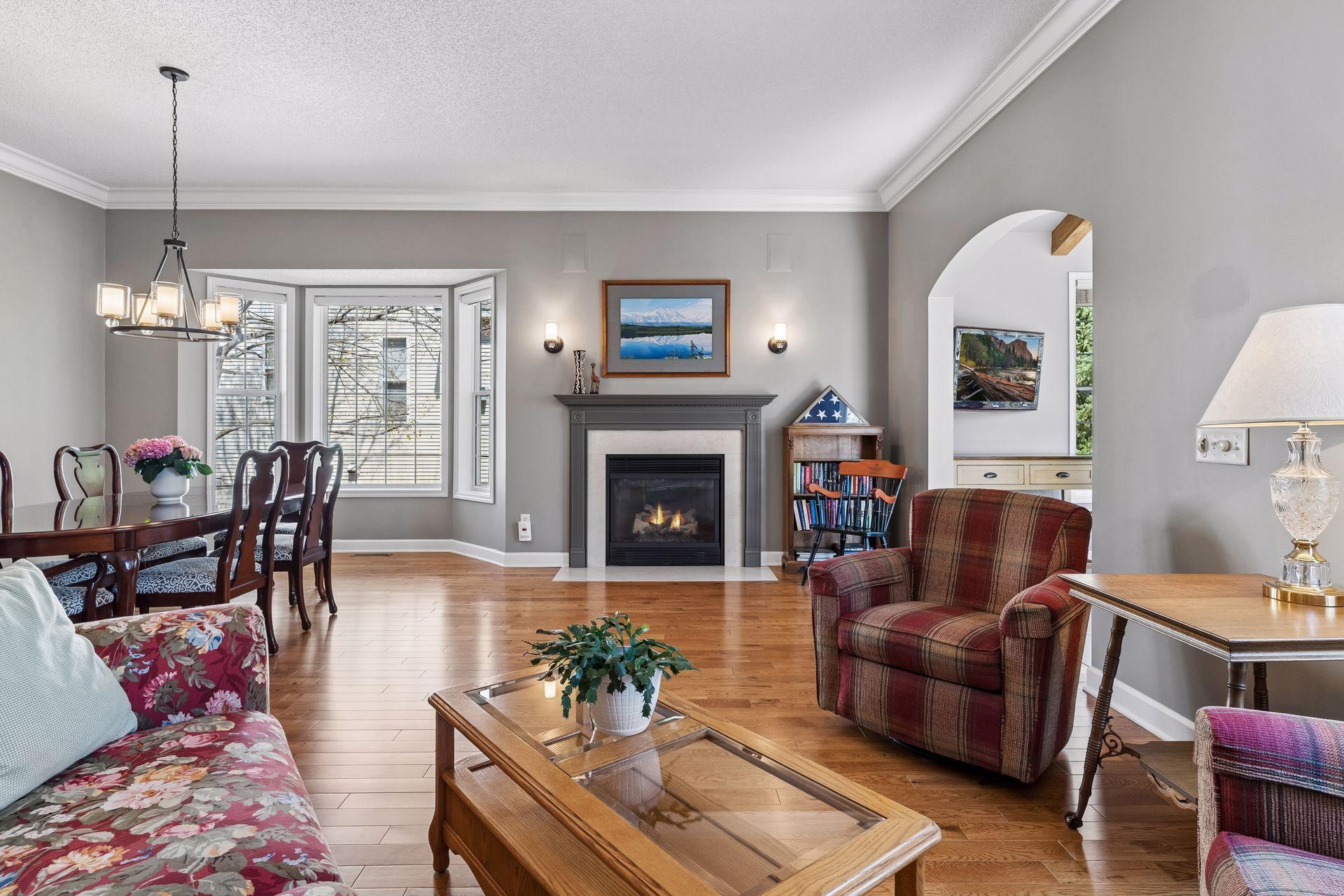 The Family Room offers a second fireplace with new designer lighting and 10' ceilings. The sellers added the arched doorways throughout the main level.