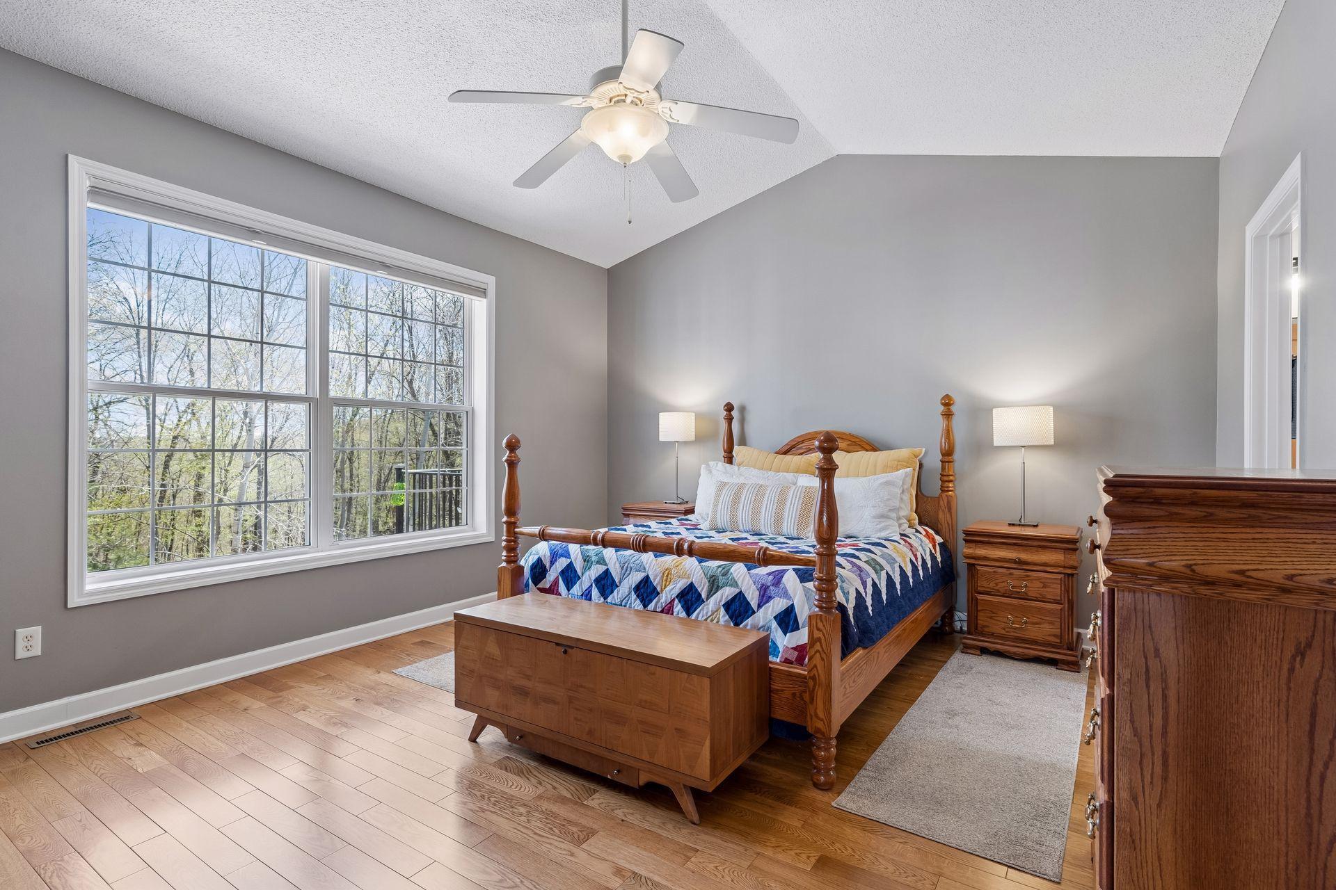 Nestled away on the main level is the vaulted Primary Suite which features a spacious walk-in closet and room darkening Hunter Douglas window coverings.