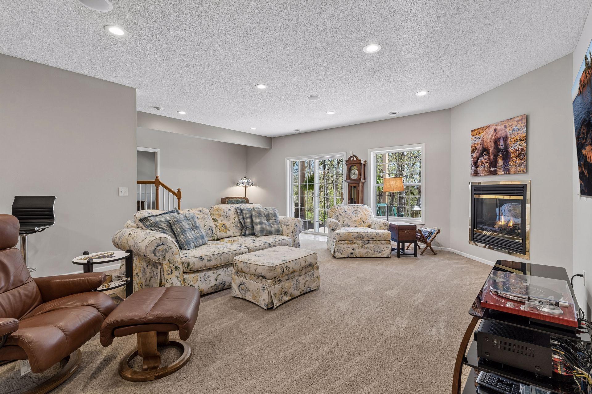 The large Family Room features the home's third fireplace and is a great spot to cheer on your favorite sports teams!