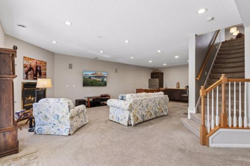 The large Family Room features the home's third fireplace and is a great spot to cheer on your favorite sports teams!