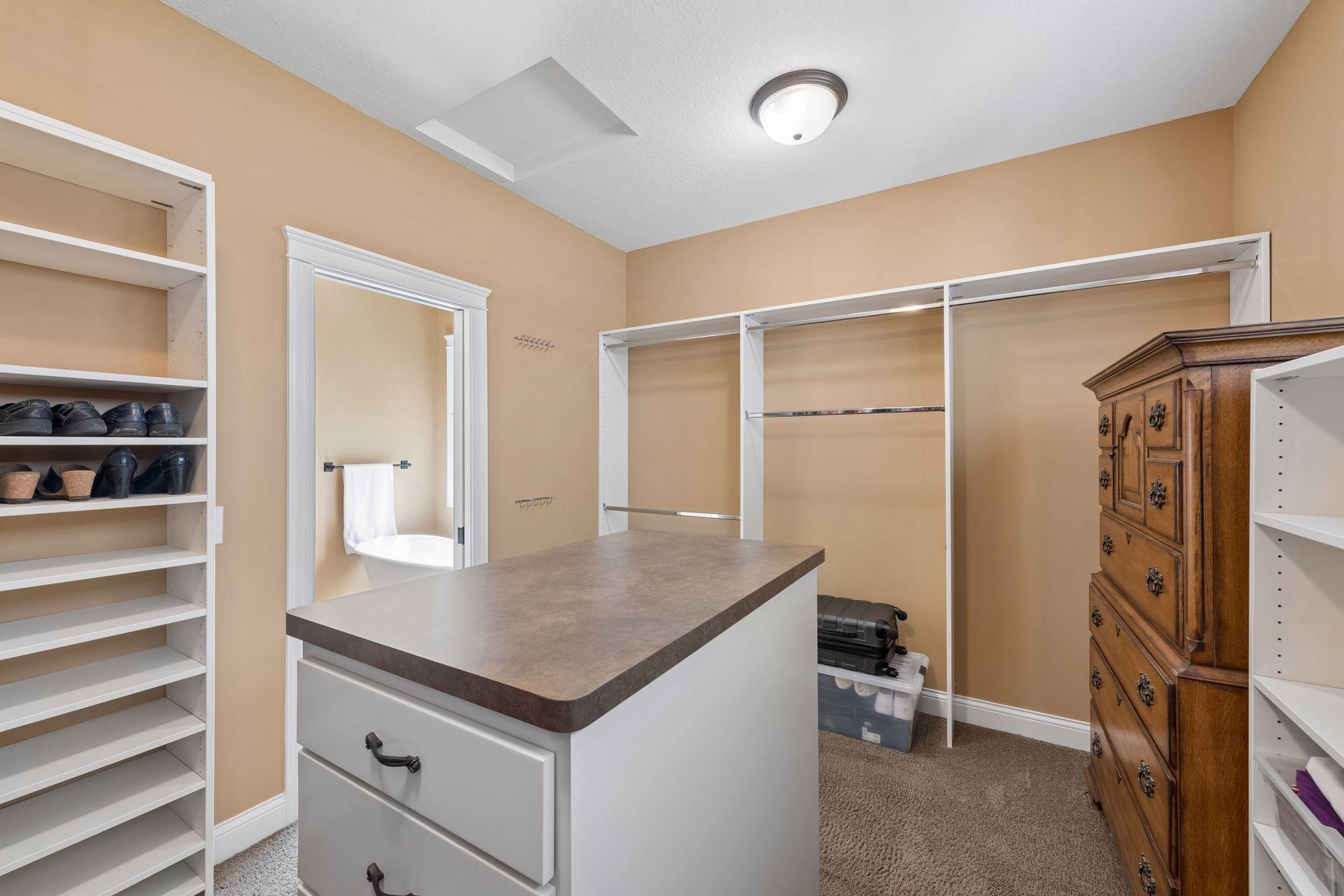 Primary closet, with center cabinet