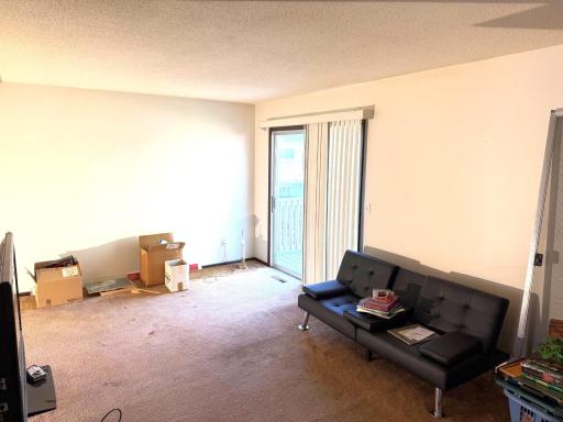 Living room with sliding door to the patio.