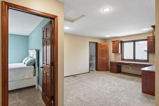 upper landing area with built in desks and upper cabinets, perfect for work/office or kids doing homework.