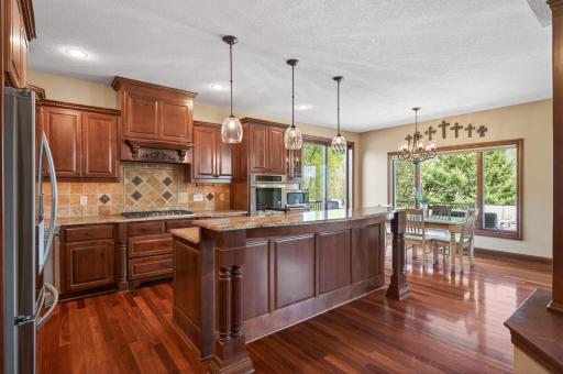 cherry stained staggered raised panel maple cabinets