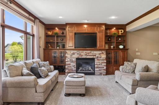 Great room, knock down ceilings, crown molding, gas fireplace with built in cabintry surround
