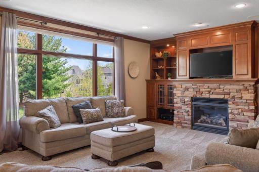 great room with large windows overlooking the backyard