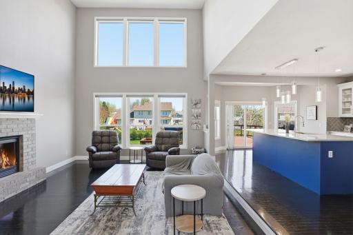 Main level living room w/ 2 story windows