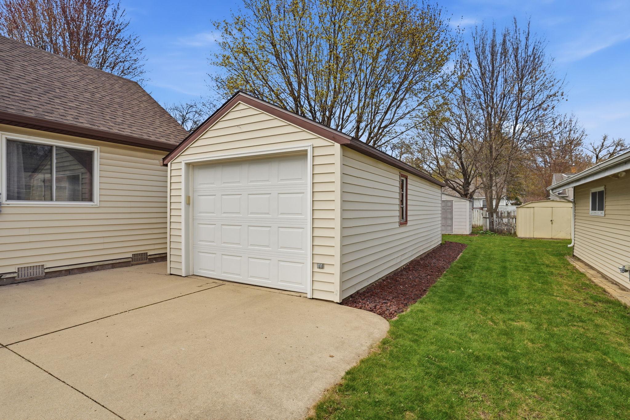 813-Detached Single Stall garage with an additional storage shed