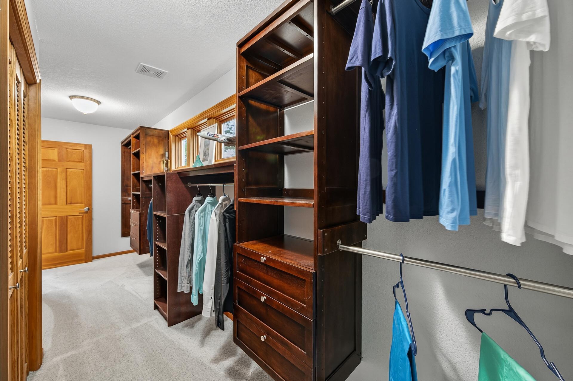 Upper Level Primary Suite Walk-In Closet