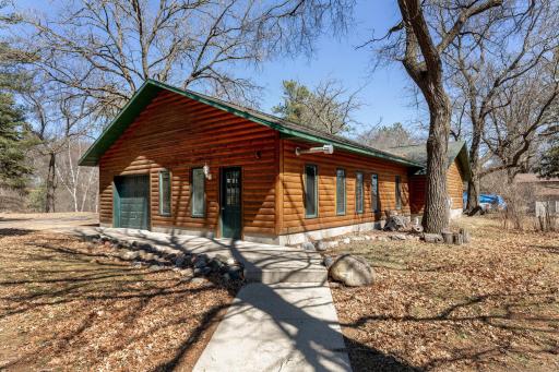 Detached garage which has a game room but also parking. '