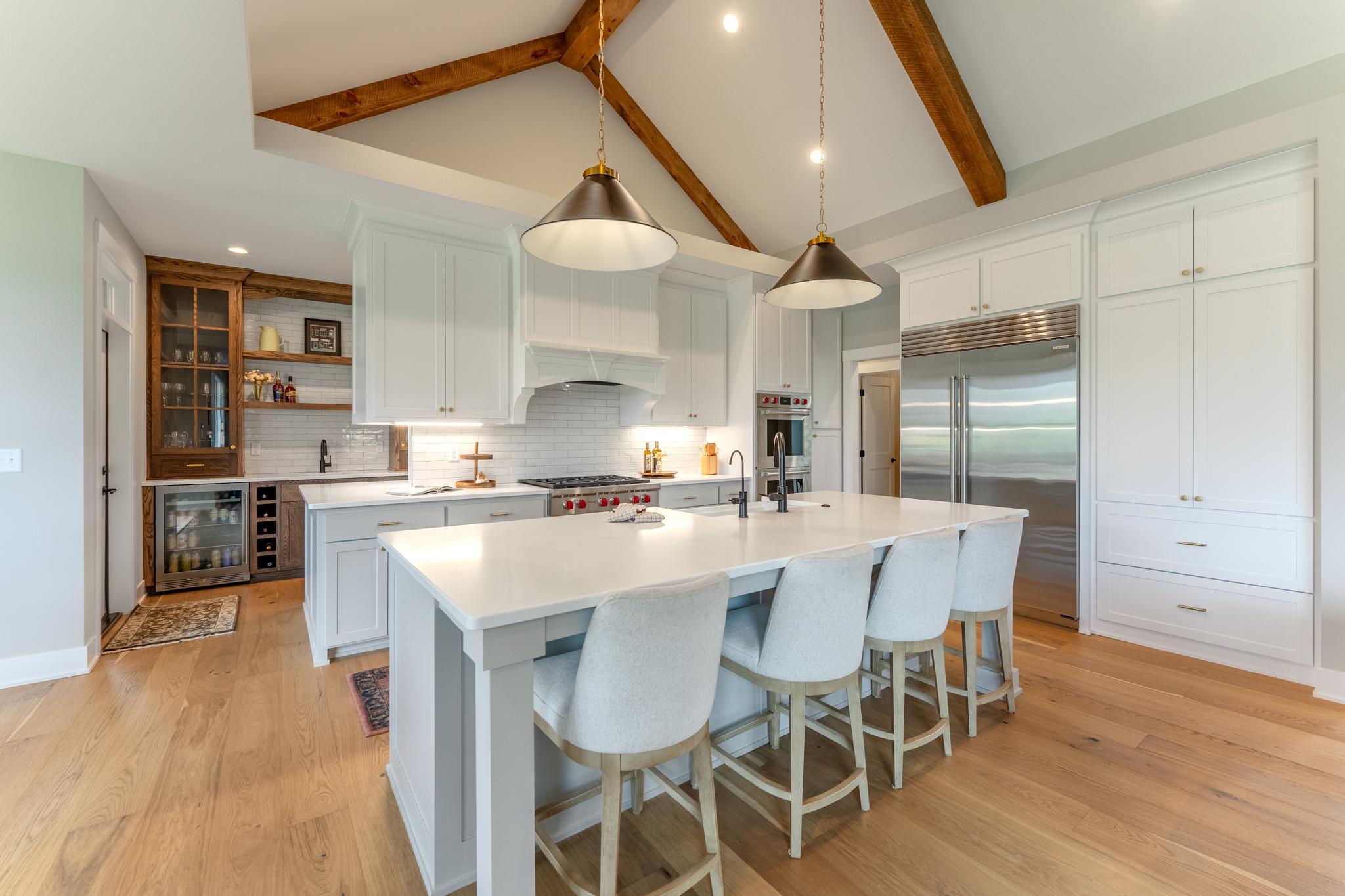 This kitchen is not only stunningly beautiful it is functional. Extra seating, Wolf and Sub Zero appliances and all the storage you need.