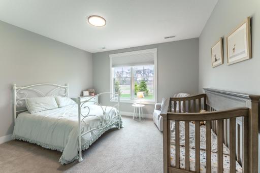 Second bedroom on this level is spacious and large window lets in plenty of natural light.