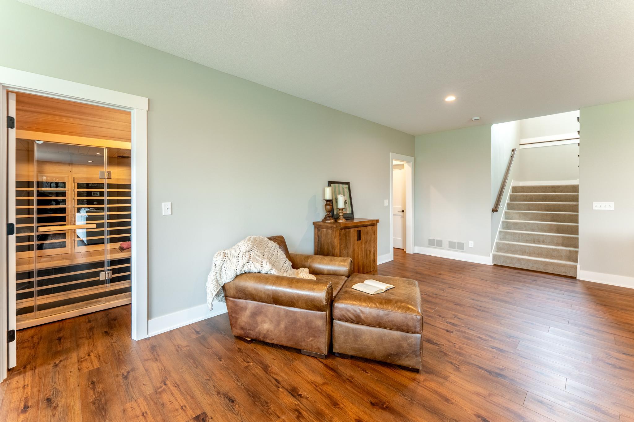 This space can easily accommodate a pool table or leave it open for larger gatherings. The infrared sauna is not included, but the spa room is ready for your choice of sauna.