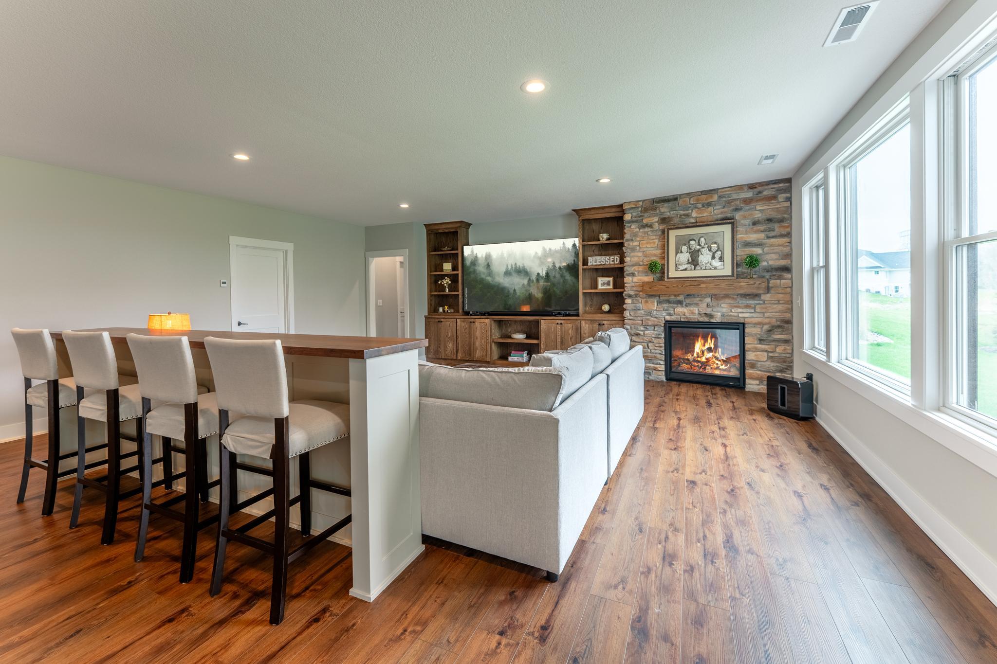 Your own private sports bar meets sophisticated entertaining space — the lower level wet bar and generous seating area is ready for every celebration life brings.
