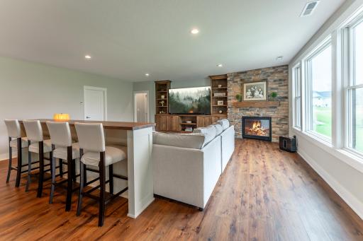 Your own private sports bar meets sophisticated entertaining space — the lower level wet bar and generous seating area is ready for every celebration life brings.