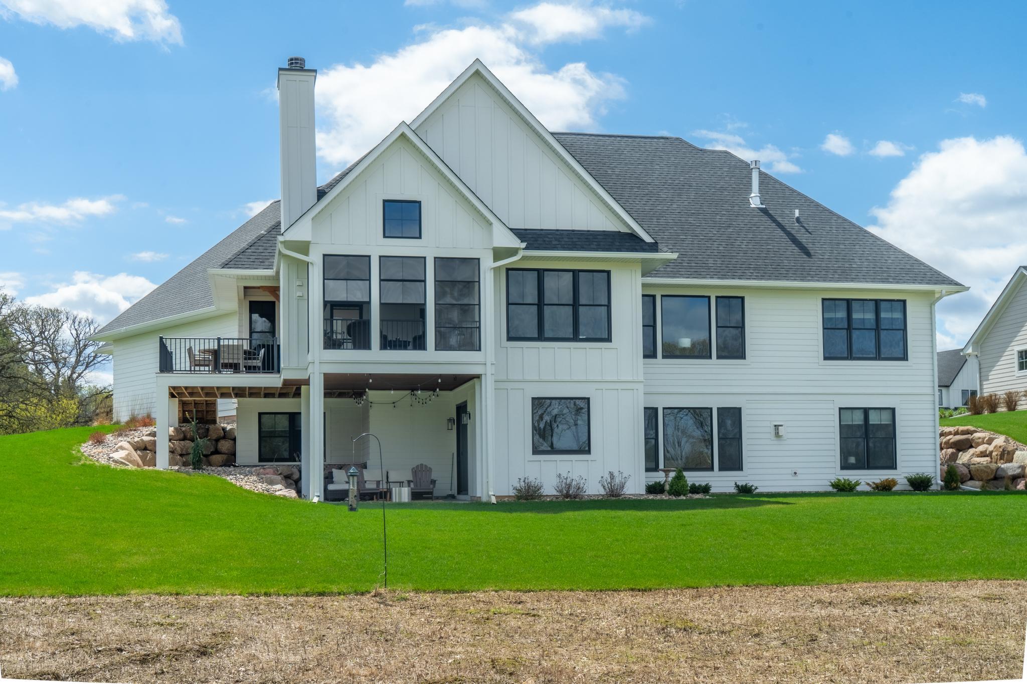 The 3 season porch walks out to the deck, which has stairs that seamlessly lead to the lower patio.