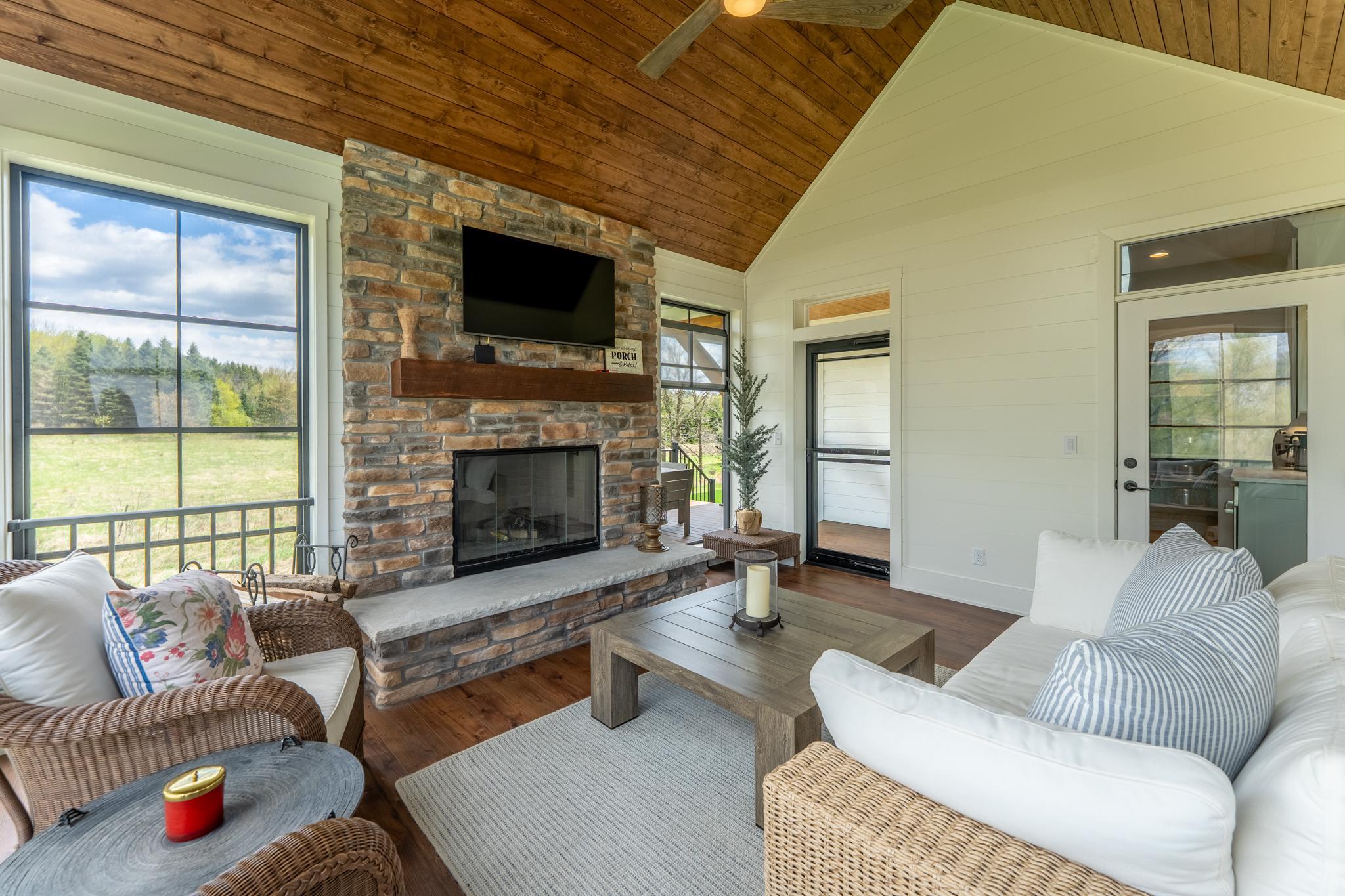 This view shows you the door from the kitchen out to the 3 season porch and the door leading out to the deck.