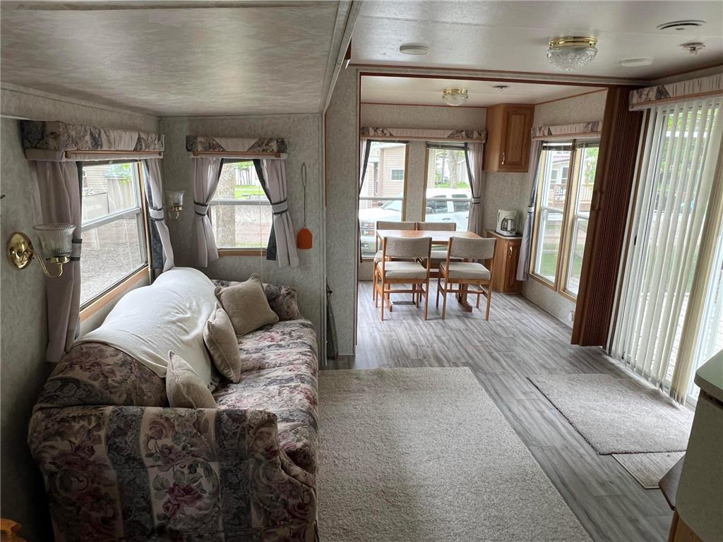 More views of the living room and dining room beyond.