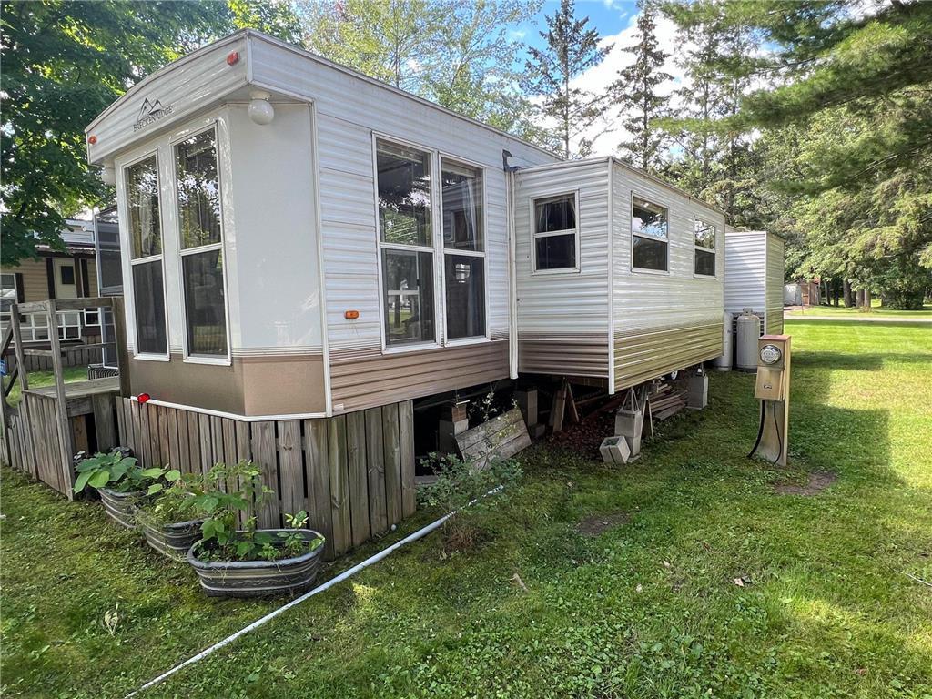 The park model features two bump-outs on one side.