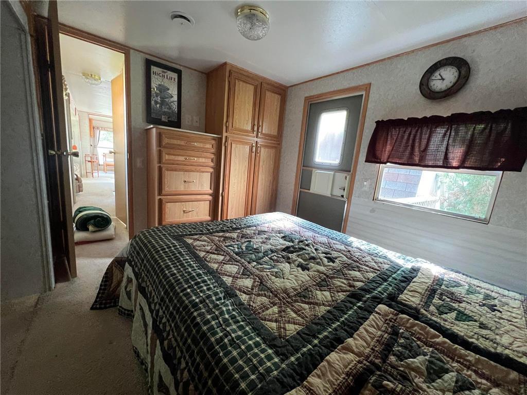 Another angle of the bedroom, highlighting the built-in cabinetry.