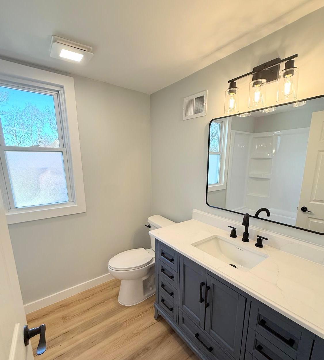 Brand new bathroom with shower and upgraded vanity and fixtures