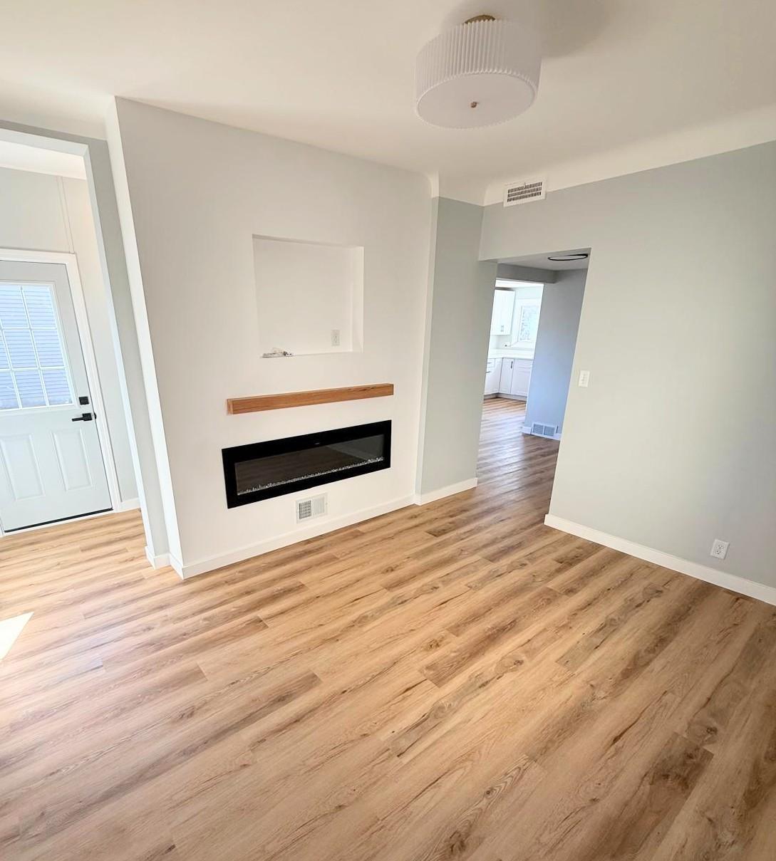 Custom fireplace built in with recessed area to hide the TV mount