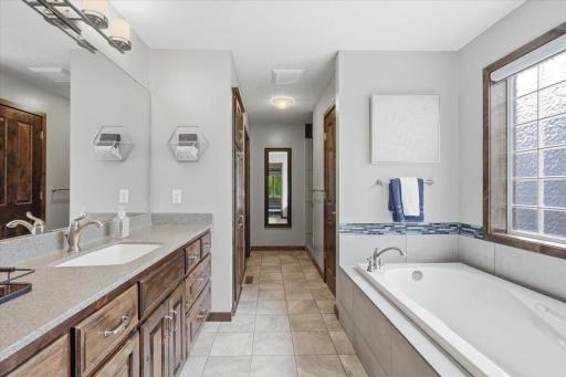 Private primary with separate soaker tub.