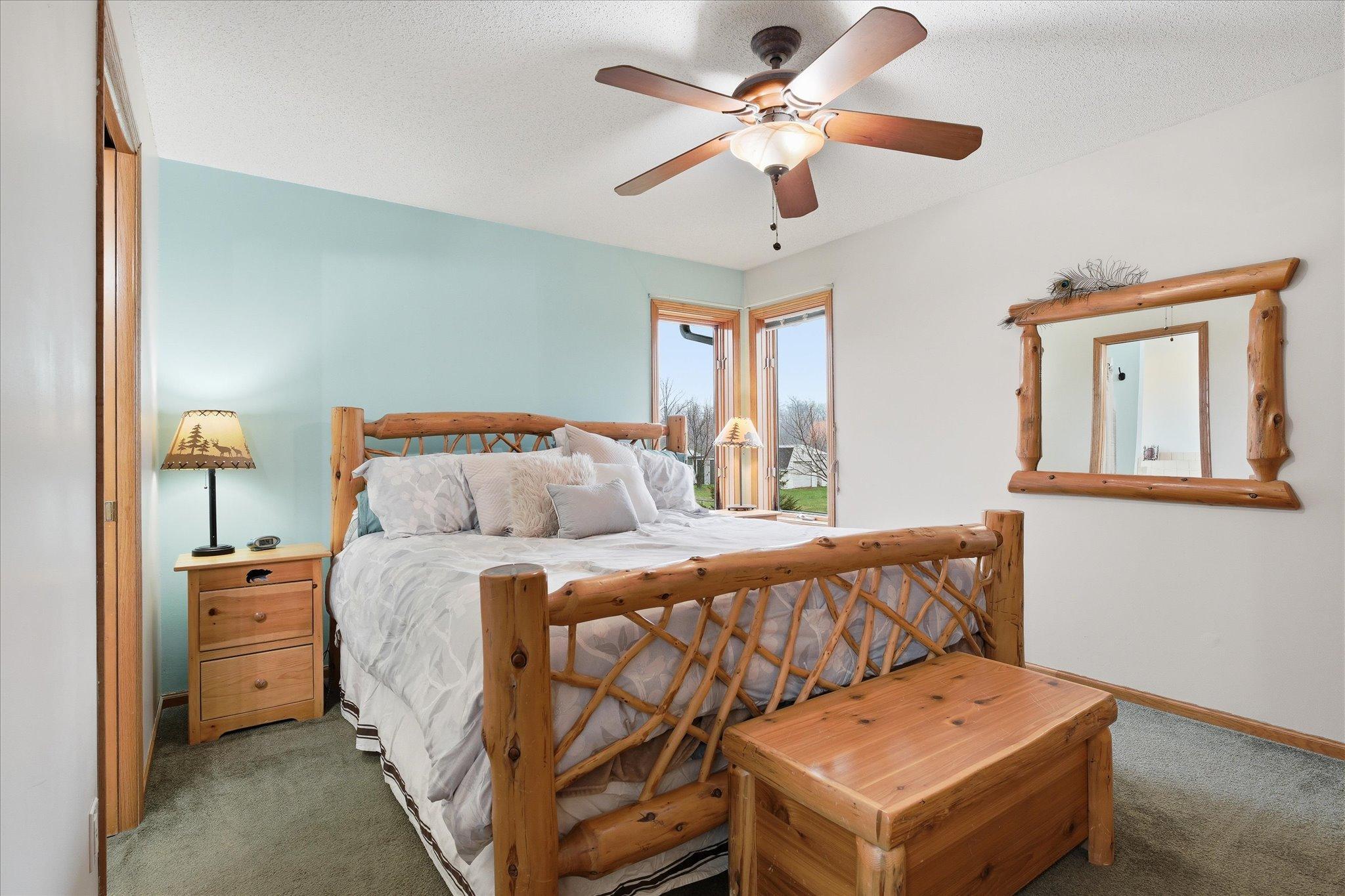 Primary bedroom with private full bathroom and walk-in closet