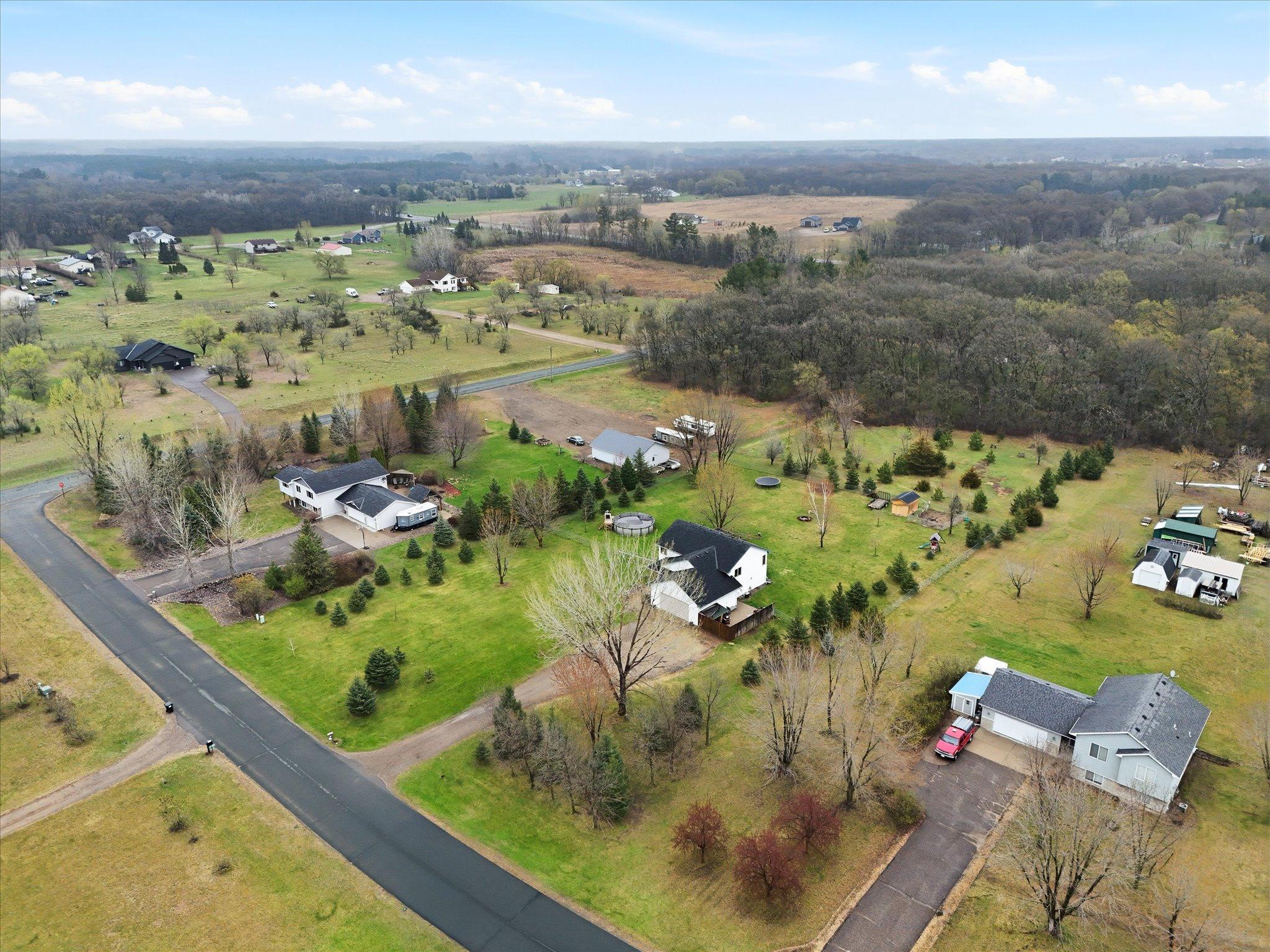 2.5-acre property with a spacious, open yard and mature trees