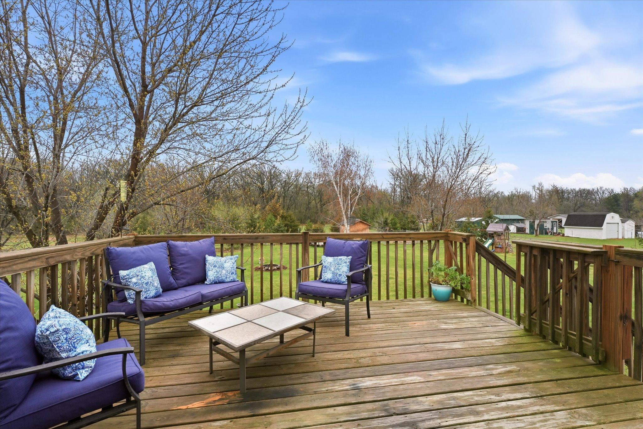 Backyard views from the deck overlooking the expansive yard