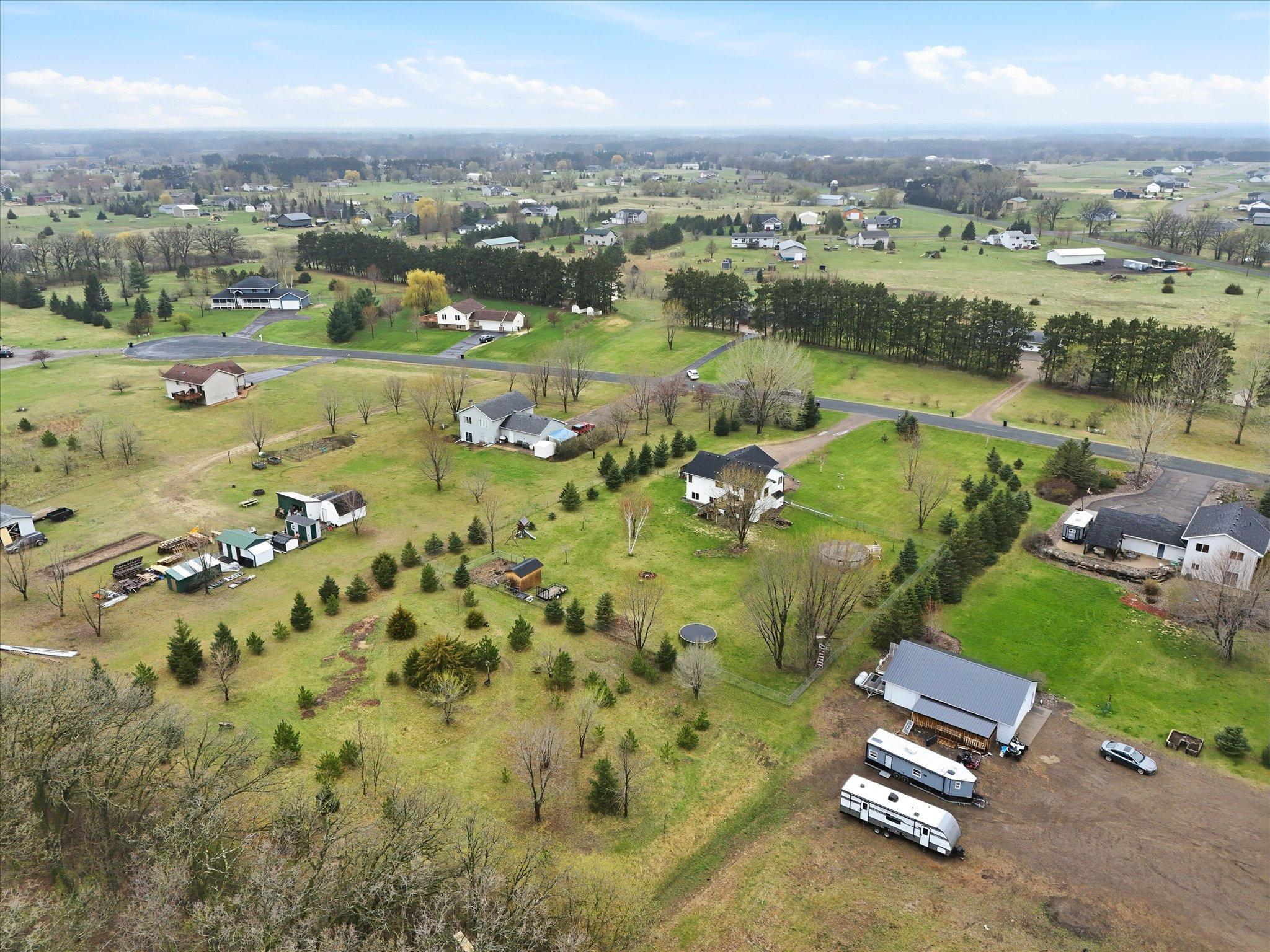 Backyard view showcasing the depth of the lot