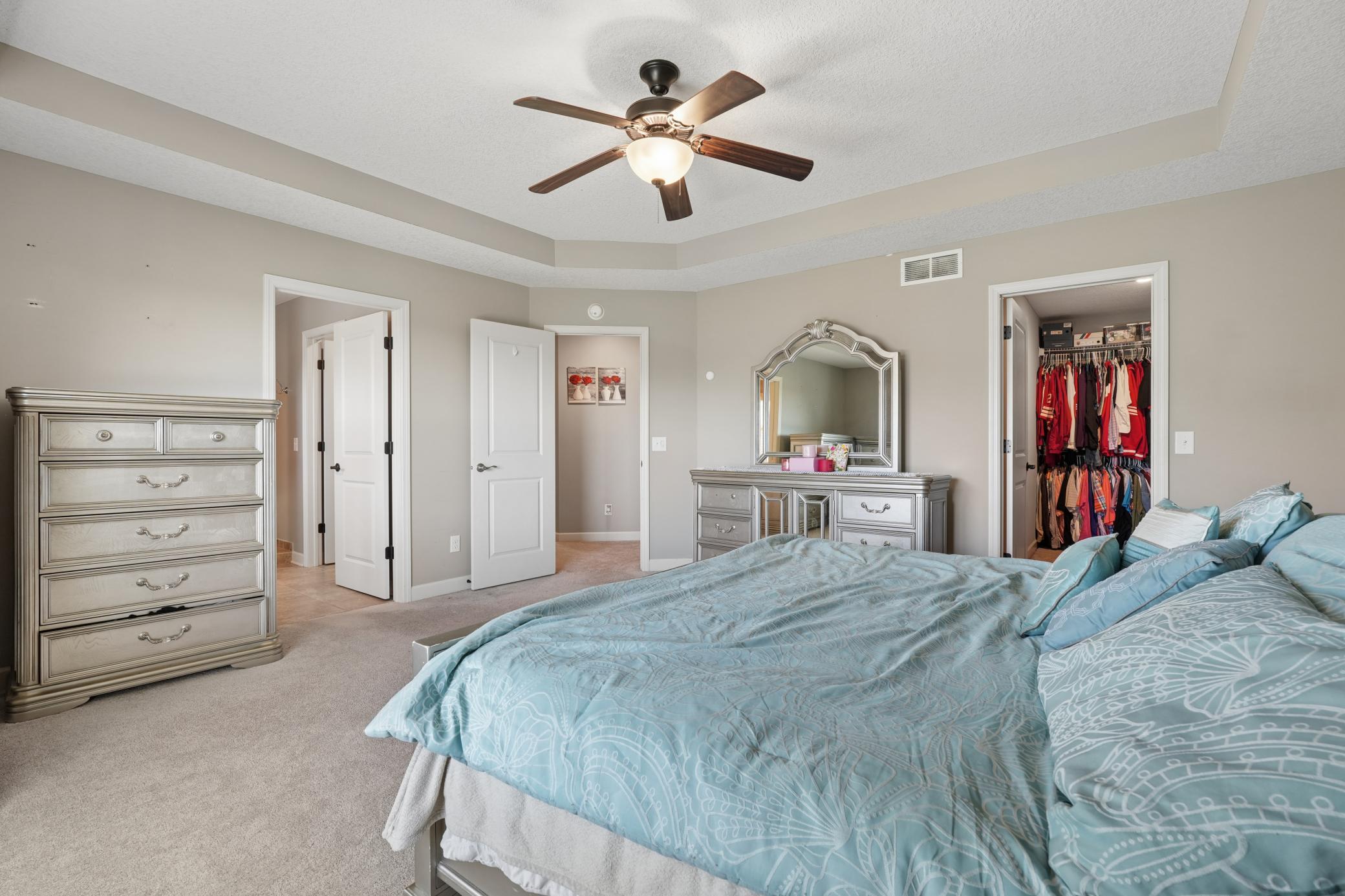 Primary bedroom with walk-in closet and en-suite