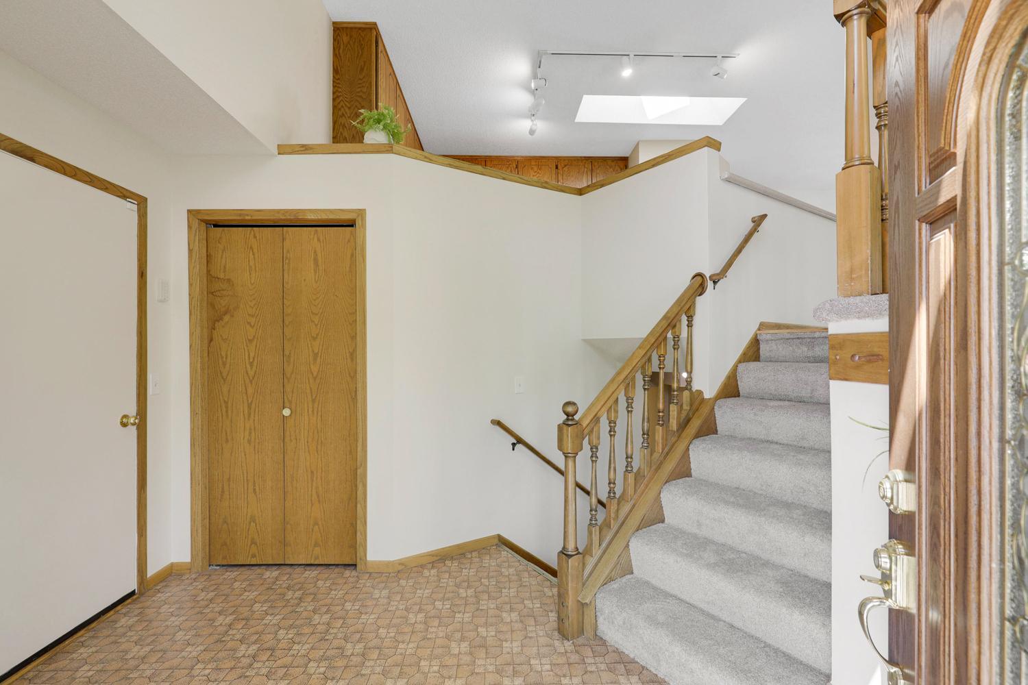 Coat closet and garage entry door.