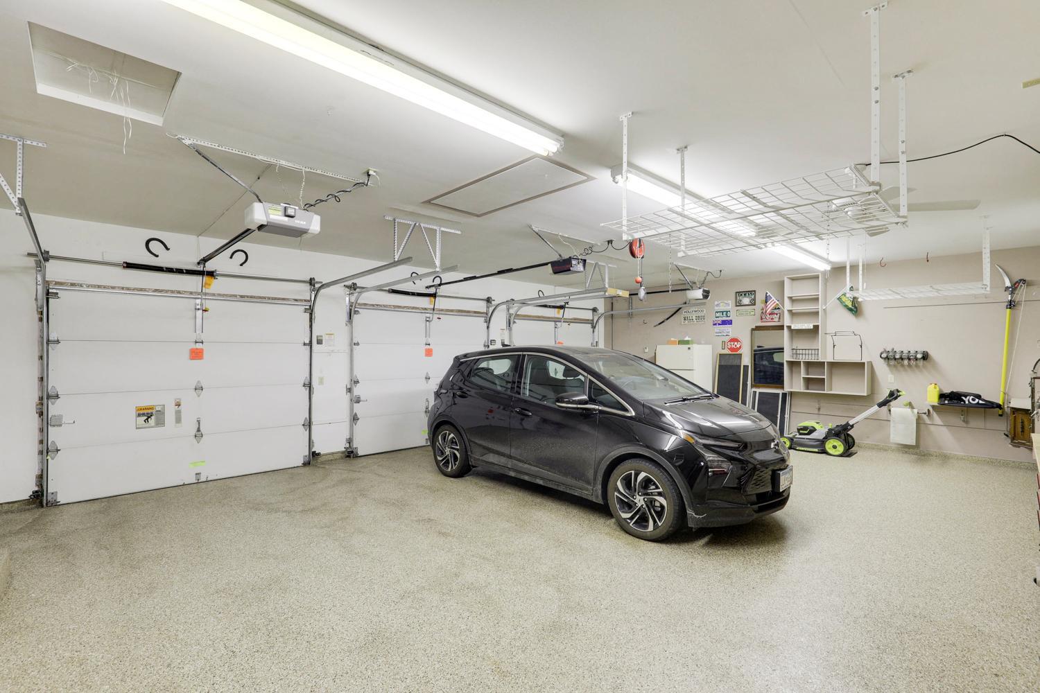 Epoxy flooring. Three garage door openers.