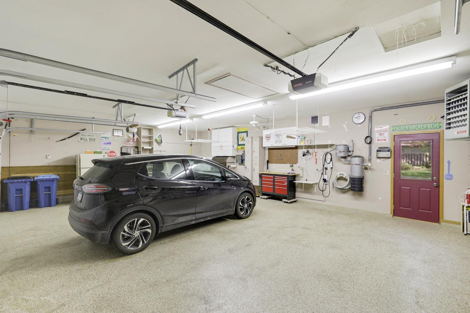 Amazing heated 3 car garage with lots of storage. Central vacum system. Walks out to the backyard.