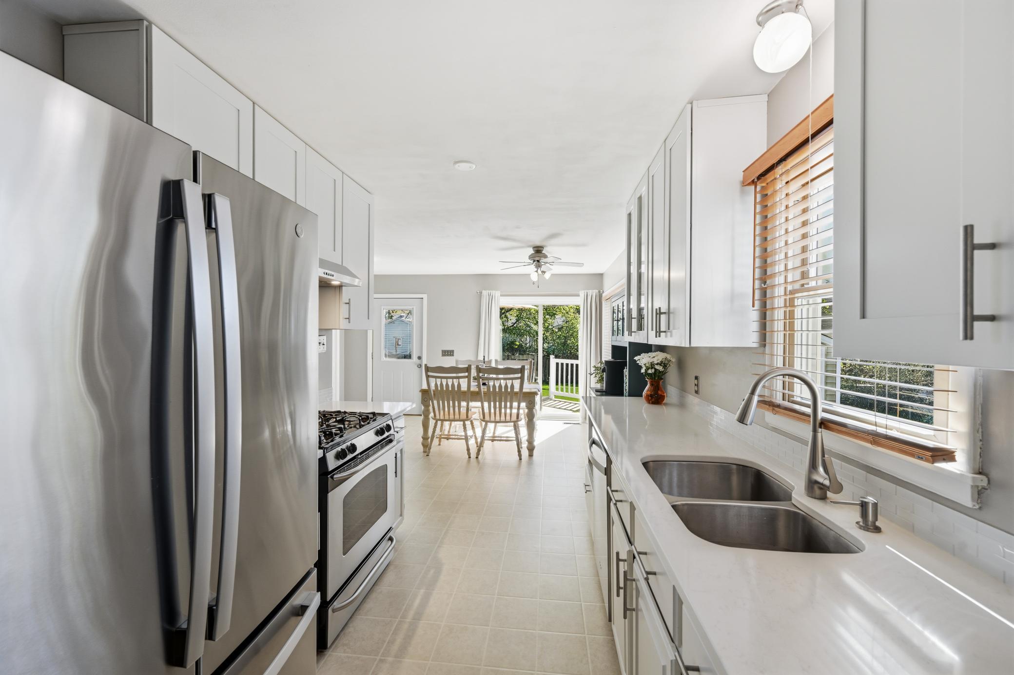The updated kitchen with new refrigerator and dishwasher make cooking a pleasure.