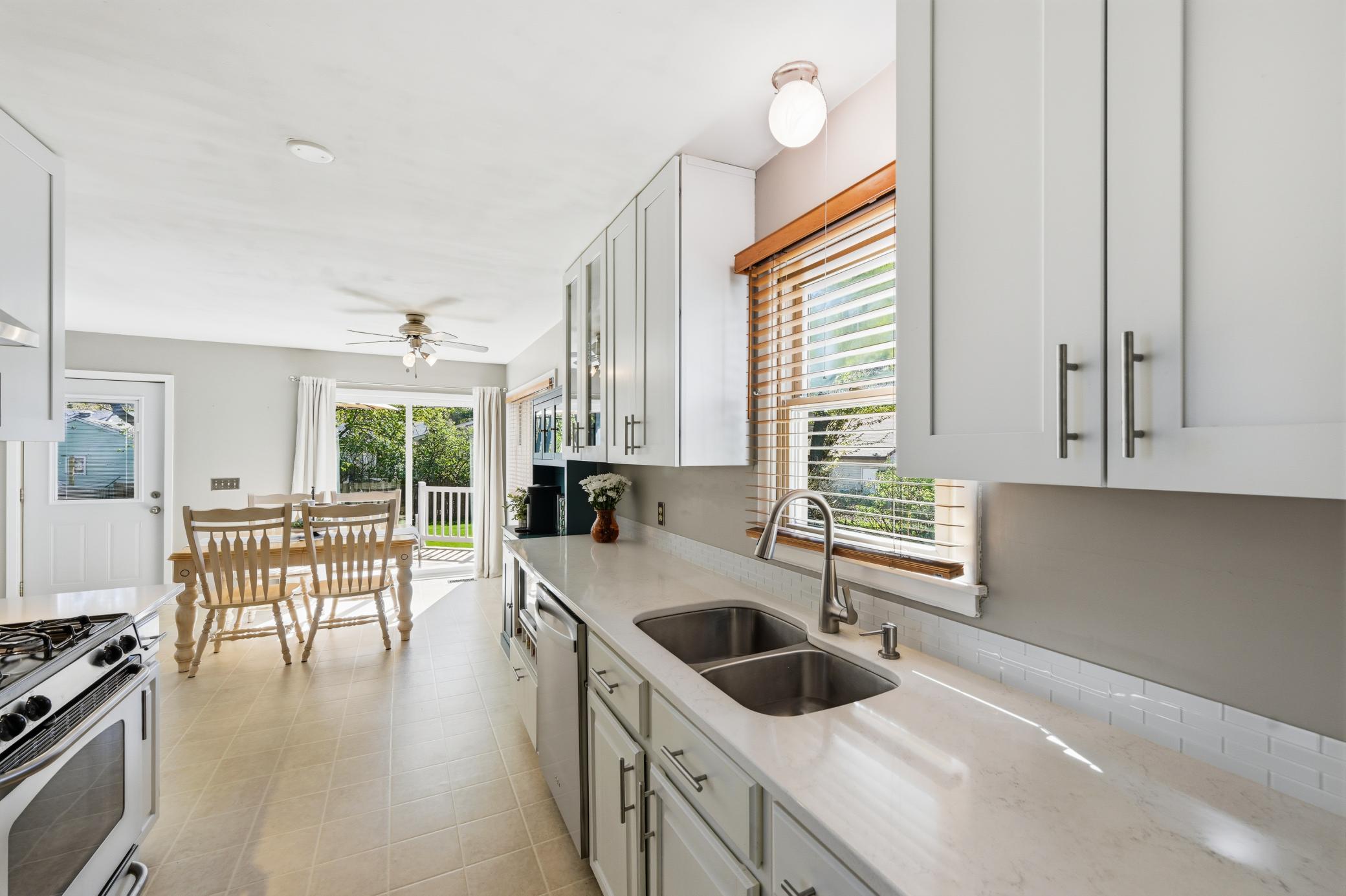 Quartz countertops and stylish cabinetry add to the appeal.
