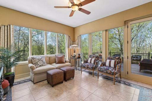 Four Seasons porch with mosaic tile flooring and French Doors