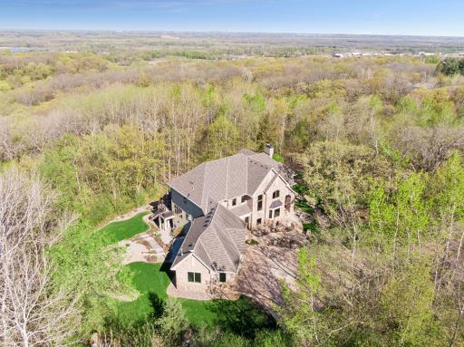 Perched atop a bluff offering tranquil views of nature, wildlife, and a serene ravine