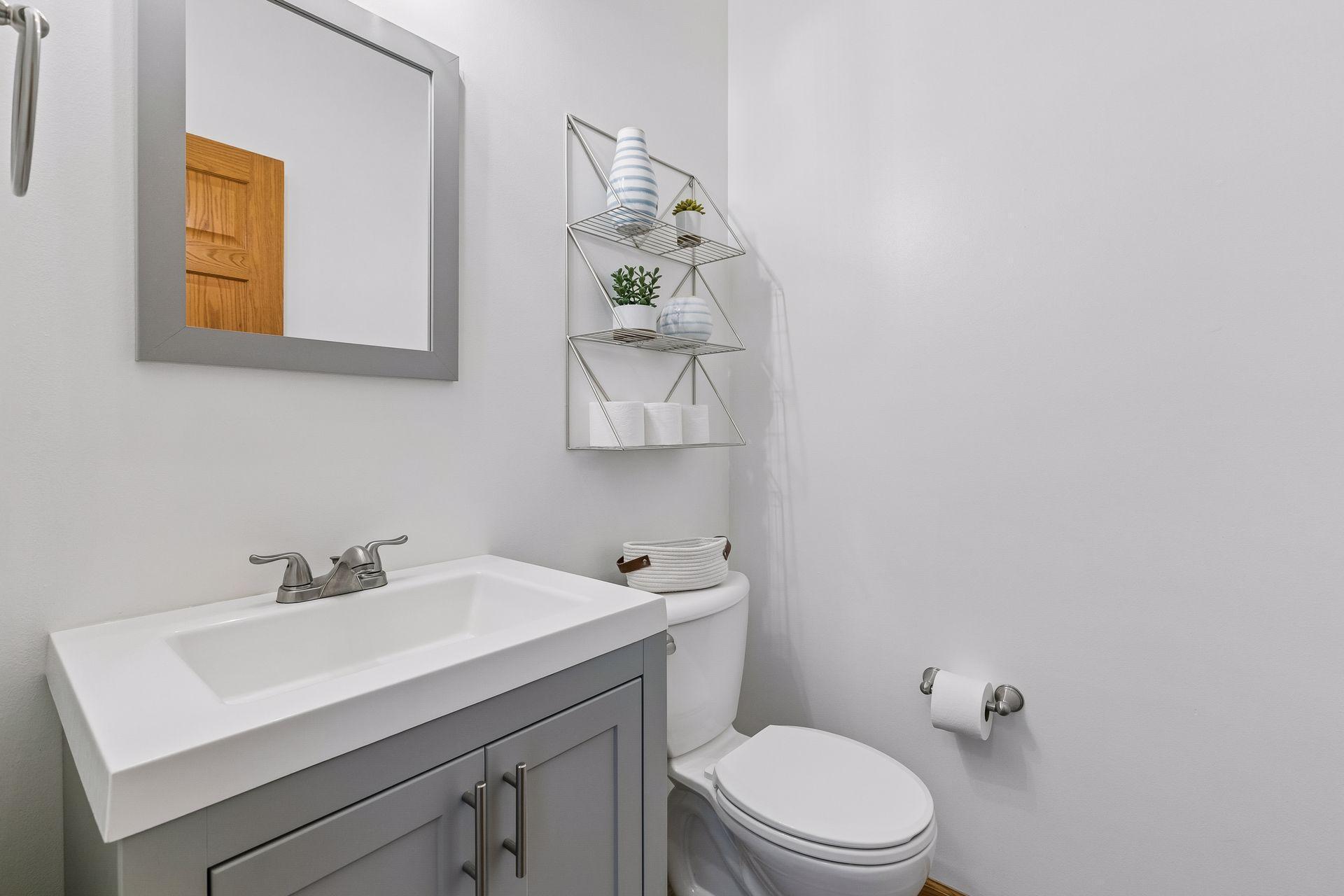 The convenient main-level half bath has been updated with clean, modern finishes.