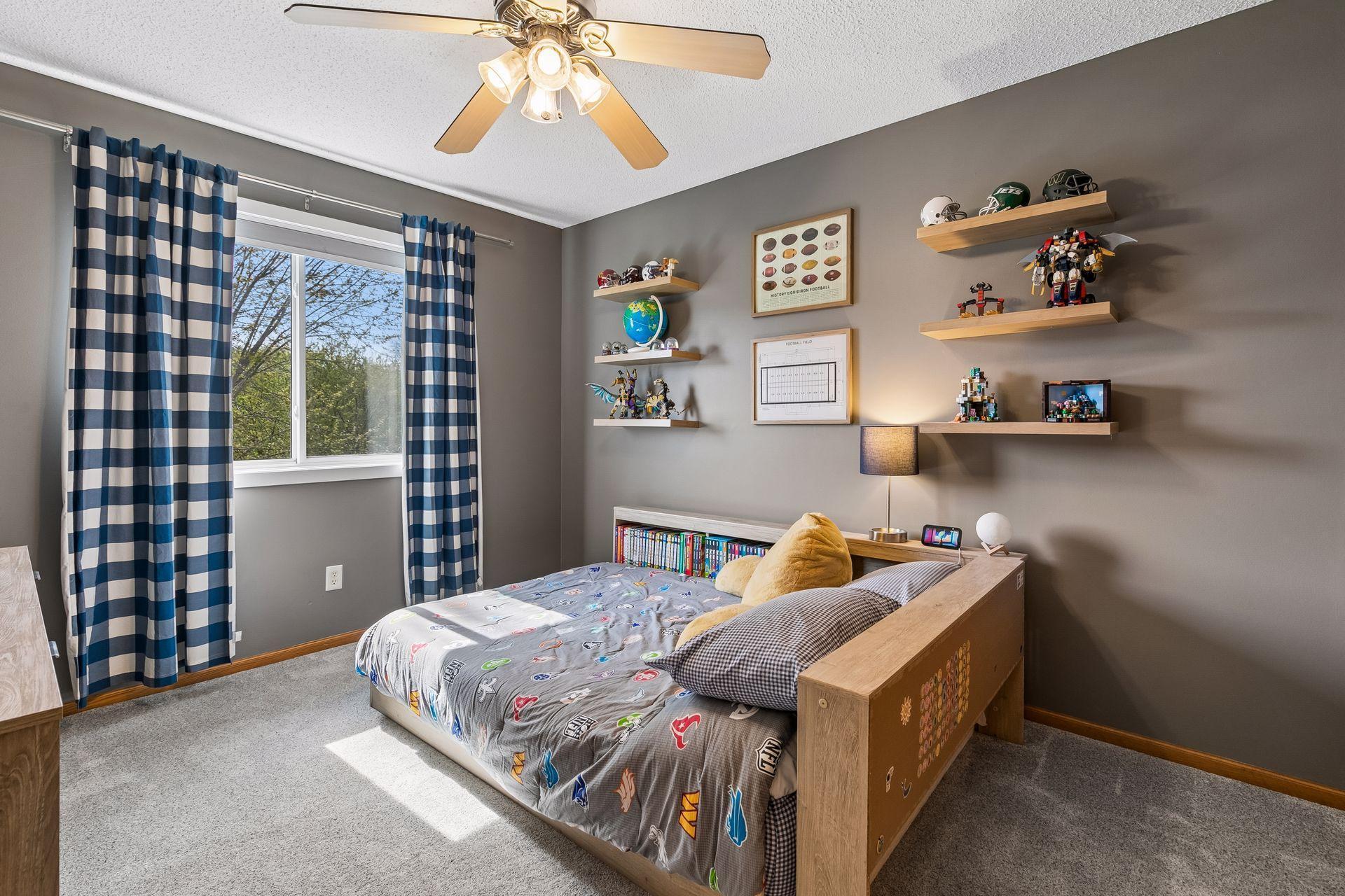 The third bedroom on the upper level faces the back of the home, overlooks the backyard and nature preserve, and gets abundant natural light through this newer window.