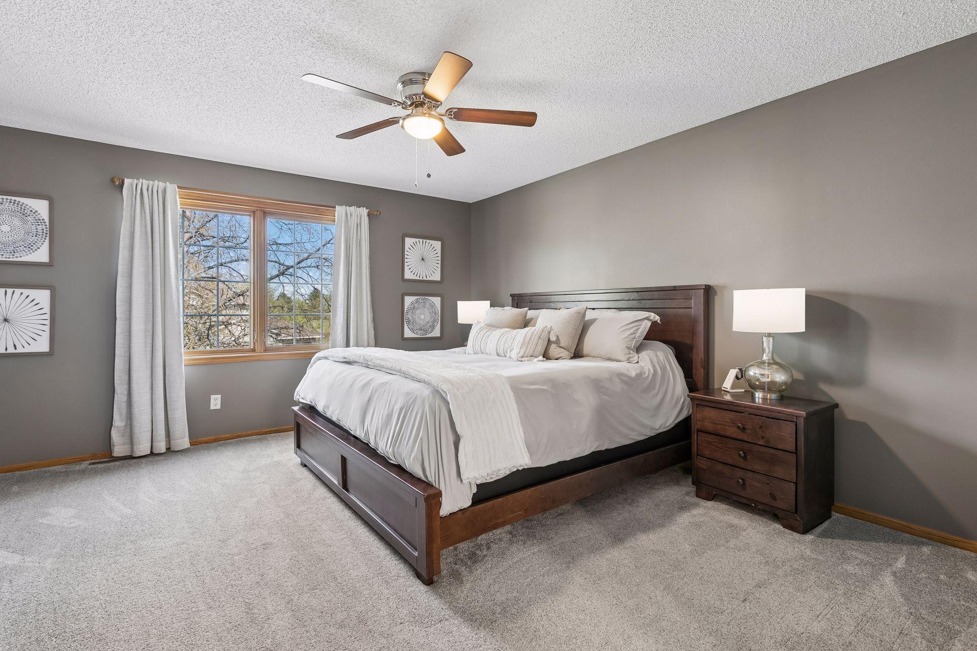 The spacious primary suite offers ample room for all of your furnishings and a comfortable retreat at the end of the day.