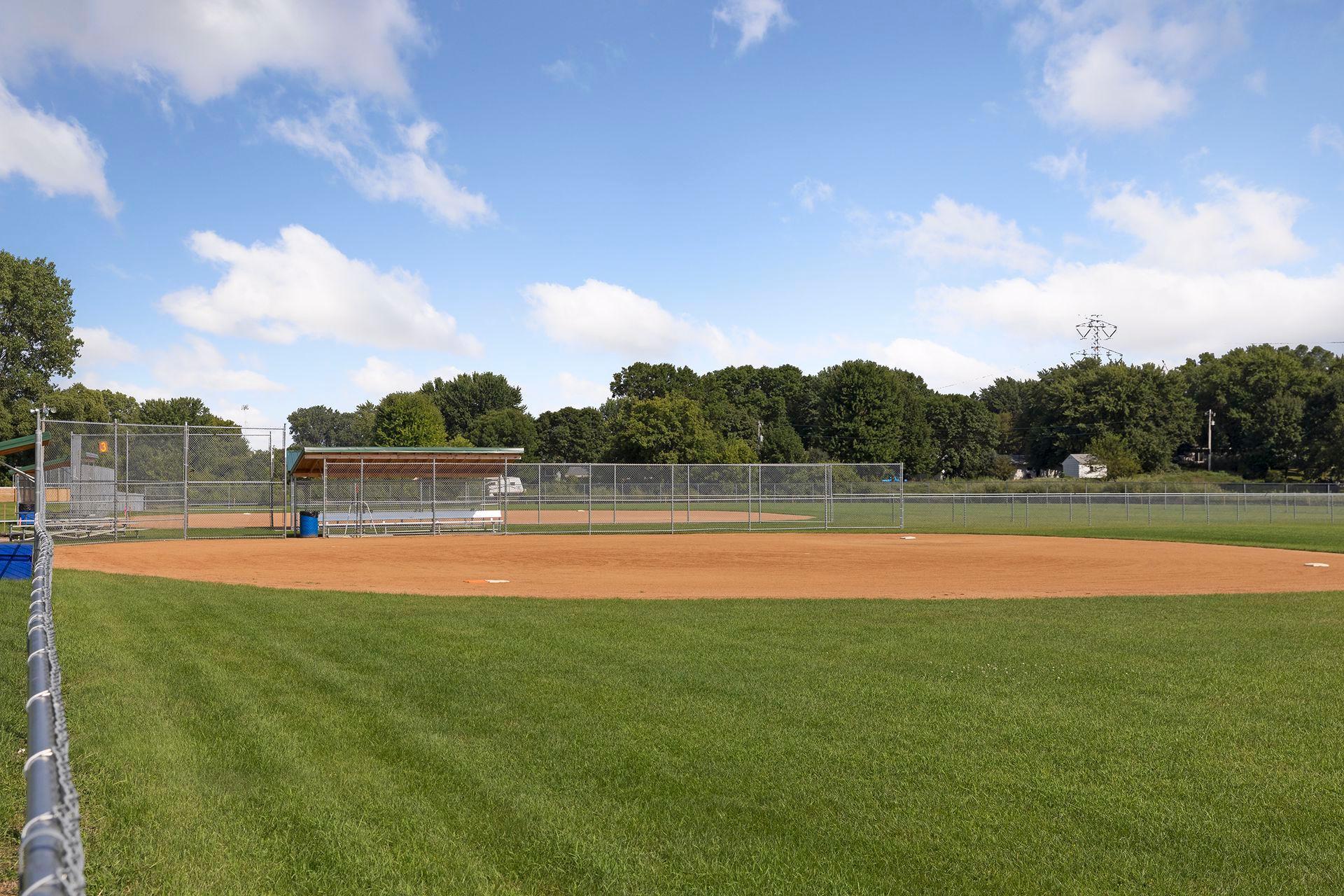 Schroeders Acres Park's ball field offers open space for recreation, sports, and community activities.